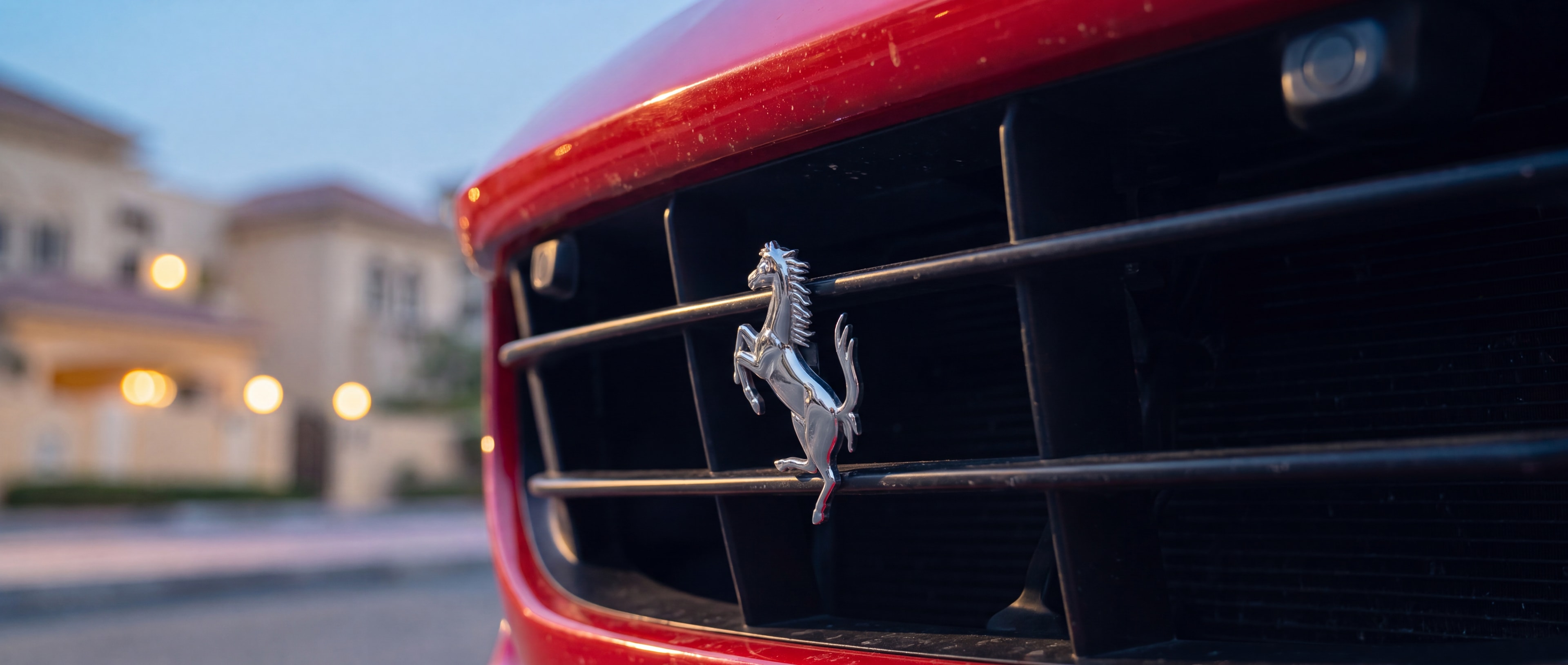 Ferrari Portofino prancing horse badge detail, Palm Jumeirah backdrop