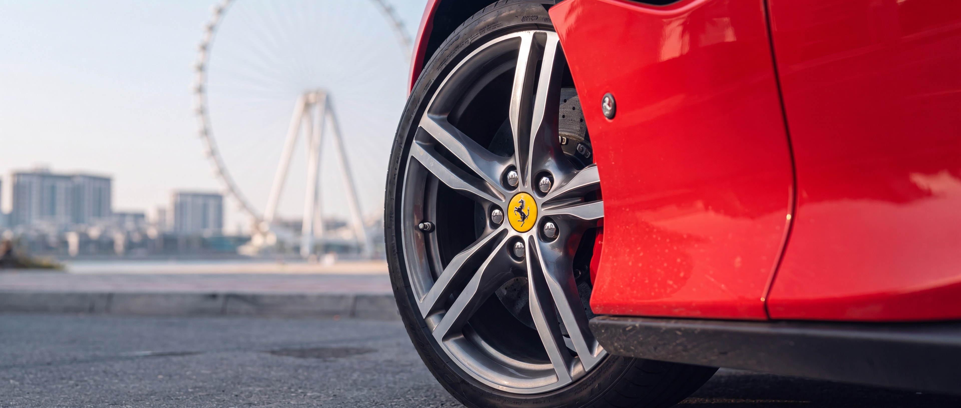Ferrari Portofino wheel and brake caliper detail, Bluewaters Island backdrop